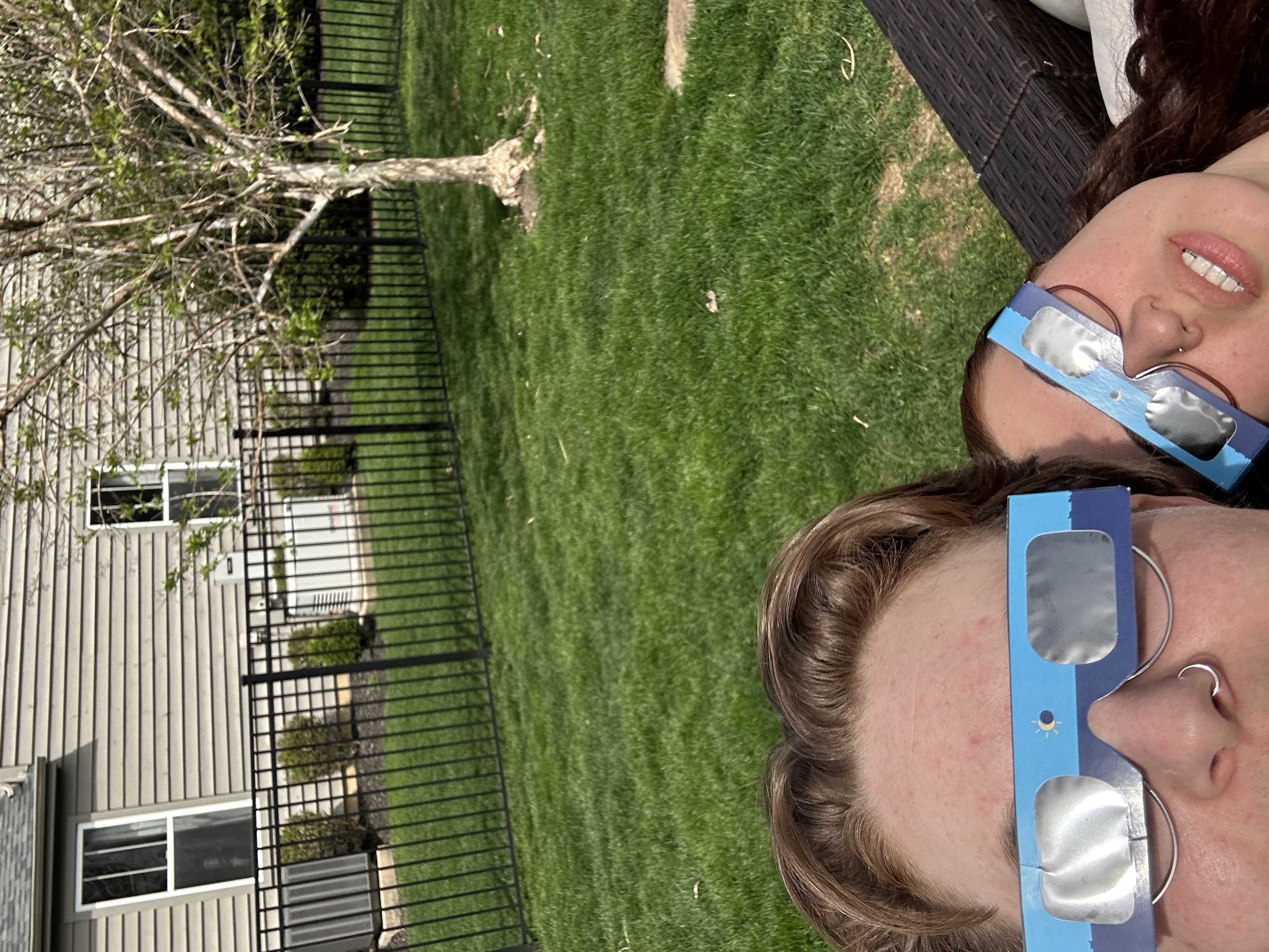 Emma and Andrea in some eclipse glasses